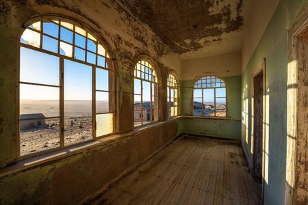 Ruins of the mining town Kolmanskop in the Namib desert near Luderitz in Namibiaの写真素材