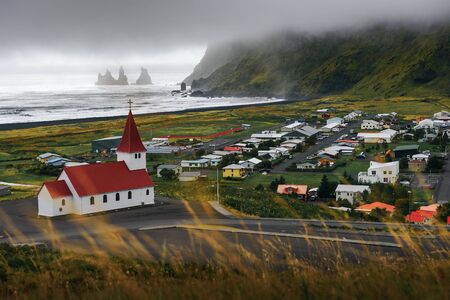 Heavy clouds over the village of Vik i Myrdal in Icelandの写真素材