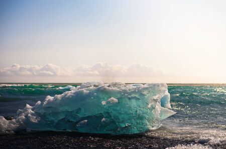 Iceberg lying on the Diamond Beach in Jokulsarlon Glacier Lagoon, Icelandの写真素材