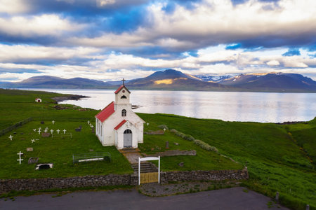 Aerial view of Innra-Holmskirkja church with a cemetery in Icelandの写真素材