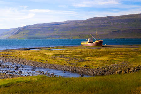 An old ship wreck on the northern coast of Iceland in the Westfjords regionの写真素材