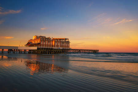 Sunset above Daytona Beach Main Street Pier With Joes Crab Shack restaurantのeditorial素材