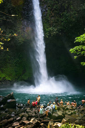 Tourists and locals visiting the La Fortuna waterfall in Costa Ricaのeditorial素材
