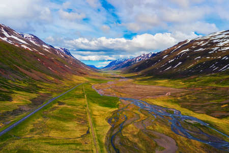 Aerial view of a road going through icelandic landscapeの写真素材