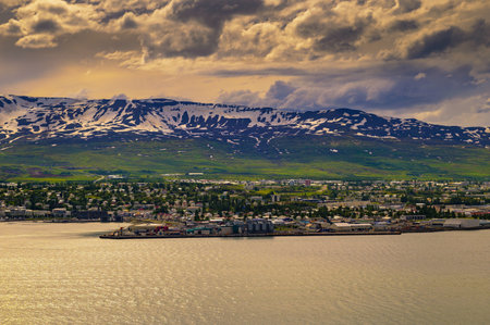 City of Akureyri with snowy mountains and fjord Eyjafjordur in northern Icelandの写真素材