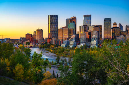 Sunset above city skyline of Calgary with Bow River, Canadaの写真素材