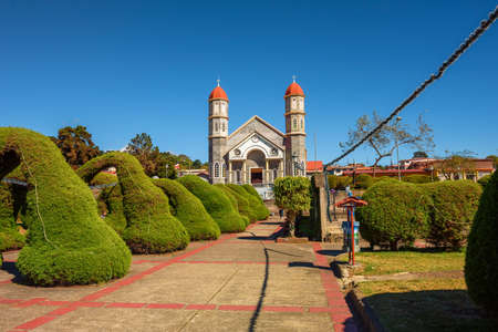 Catholic church with a park in Zarcero, Costa Ricaの写真素材