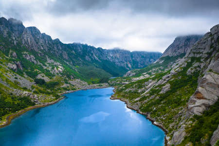 Aerial view of mountains and a lake in Lofoten Islands, Norwayの写真素材