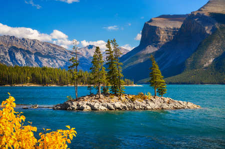 Small island with trees on Lake Minnewanka in Banff National Park, Canadaの写真素材
