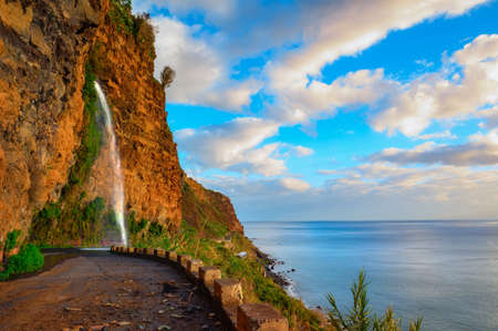 Waterfall on an old road near Ponta do Sol in Madeira Island, Portugalの写真素材