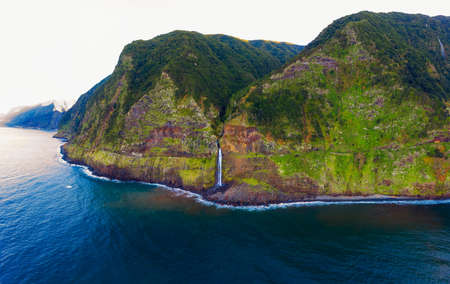 Aerial view of a waterfall near Seixal village in the Madeira Islands, Portugalの写真素材