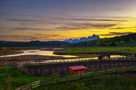 Sunset above the Grand Teton Mountains and Buffalo Fork of the Snake Riverの写真素材