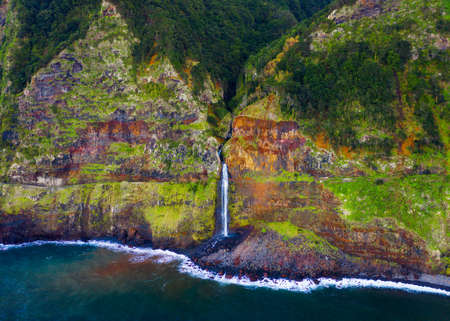 Aerial view of a waterfall near Seixal village in the Madeira Islands, Portugalの写真素材