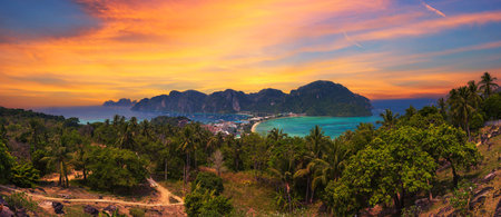 Sunset over Tonsai Village and the mountains of Koh Phi Phi island in Thailandの写真素材