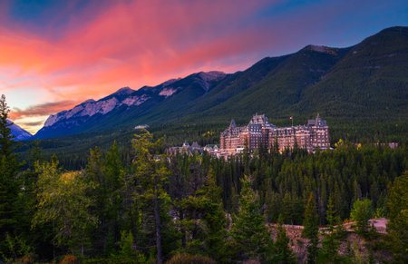 Sunrise over Fairmont Banff Springs Hotel in Rocky Mounatins, Canadaのeditorial素材
