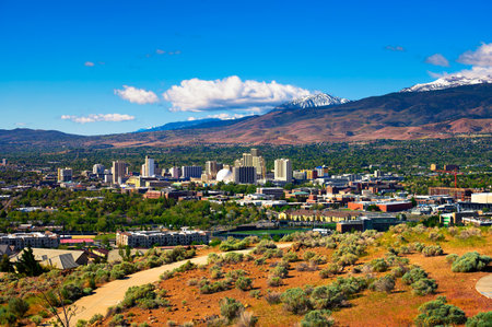 Downtown Reno skyline, Nevada, with hotels, casinos and surrounding mountainsの写真素材