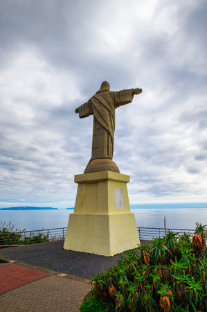 The Christ the King statue, a catholic monument on Madeira island, Portugalのeditorial素材