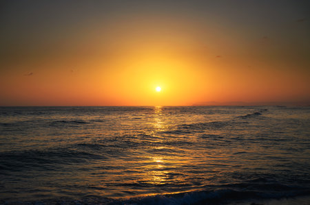 Sunset above Arabian Sea and a beach in Salalah, Omanの写真素材