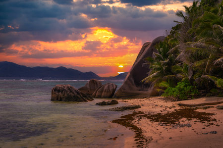 Colorful sunset over Anse Source Dargent beach at La Digue Island, Seychellesの写真素材