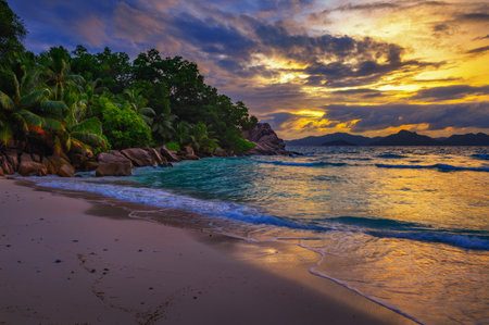 Colorful sunset over Anse Severe Beach at the La Digue Island, Seychellesの写真素材