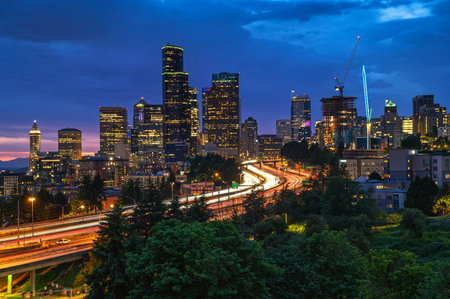 Seattle downtown skyline, with traffic on the I-5 freeway, viewed at dusk