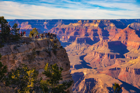 Tourists enjoy beautiful sunset above Grand Canyon National Park from a scenic viewpoint .の写真素材