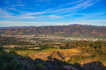 Aerial view of Burbank, California from Mt. Lee at sunset, with the Verdugo Mountains in the backgroundの写真素材