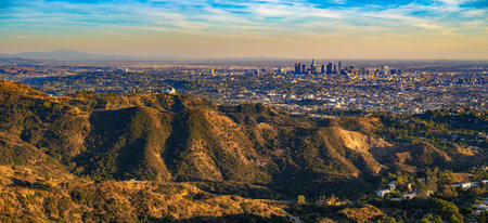 Panorama of Griffith Observatory and Los Angeles skyline photographed from Mount Lee at sunset.
