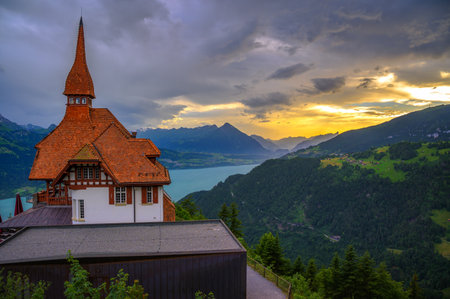 Scenic sunset over Lake Thun and the Swiss Alps, viewed from Harder Kulm in Switzerland.の写真素材