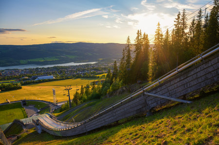 Scenic sunset view of Lillehammer, Norway, from the ski jumping arena overlooking Lake Mjosa and...