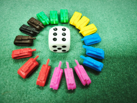 Dice and dominoes on green background. Toned.の写真素材