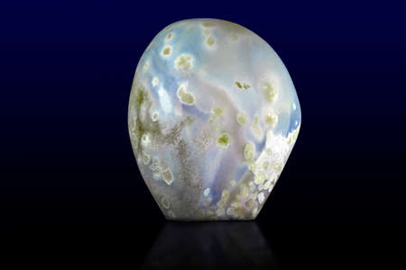 Beautiful blue agate gemstone on dark background