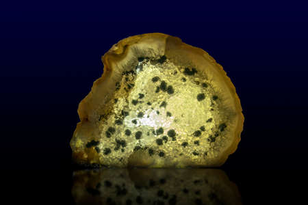 Close up of a Slice Agate Gemstone on dark background, close up