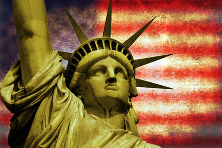 Statue of Liberty on Island in New York with flagの写真素材