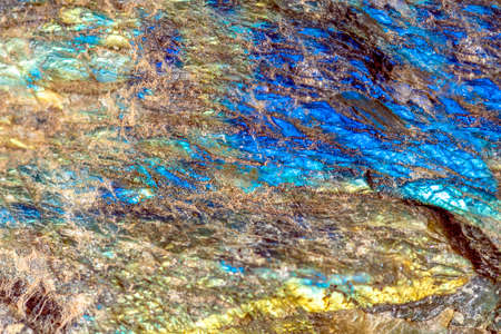 Macro shooting of gem raw natural Labradorite mineral texture as very nice natural background,