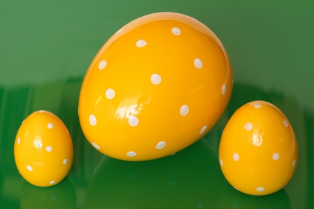 Easter eggs, pottery, on a green backgroundの写真素材