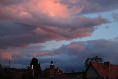 setting sun in the cloudsの写真素材