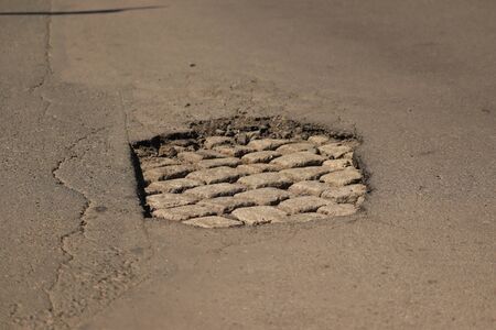 big hole on the street car trap,の写真素材