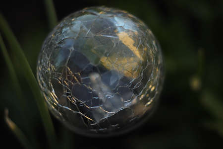 glass ball as solar lighting in the gardenの写真素材