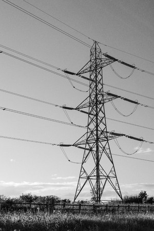 high voltage power tower in black and white, electricity pillarの写真素材