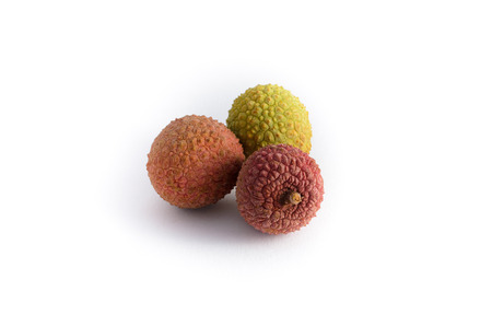 three lychee fruits isolated on white backgroundの写真素材