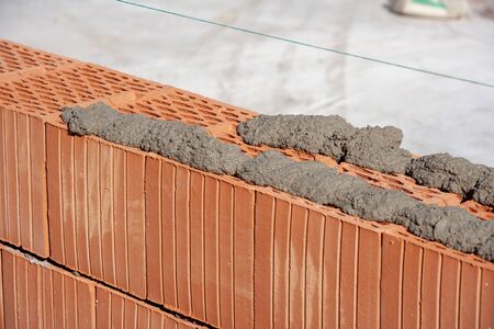 Construction site. Brick wall and mortar