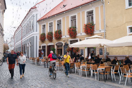 CLUJ-NAPOCA, ROMANIA - OCTOBER2019: People walking on the streets of Cluj-Napoca City Center.のeditorial素材