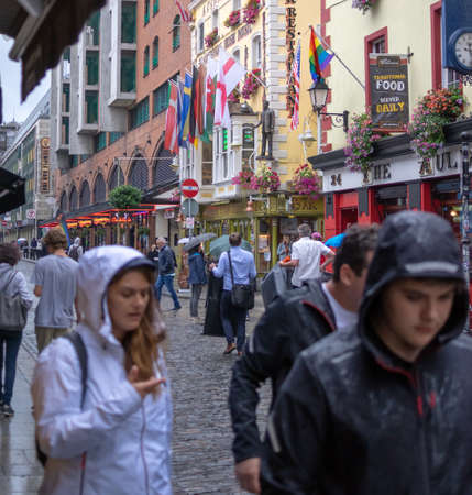 Dublin,Ireland - JULY 30, 2019: People walking on the streets of famous  Temple Bar area.のeditorial素材