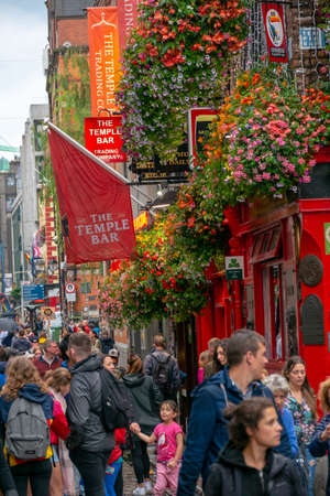 Dublin,Ireland - JULY 30, 2019: People walking by famous Irish pub , THE TEMPLE BARのeditorial素材