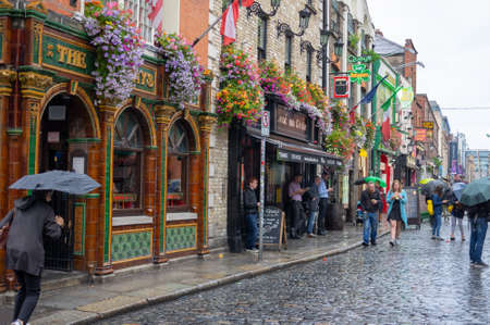 Dublin,Ireland - JULY 30, 2019: People walking on the streets of famous  Temple Bar area.のeditorial素材