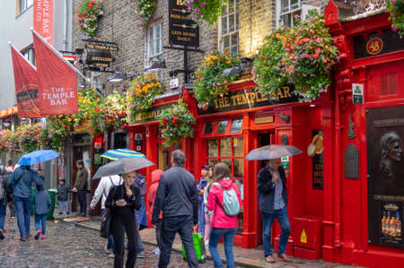 Dublin,Ireland - JULY 30, 2019: People walking by famous Irish pub , THE TEMPLE BARのeditorial素材