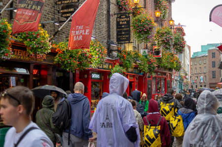 Dublin,Ireland - JULY 30, 2019: People walking by famous Irish pub , THE TEMPLE BARのeditorial素材
