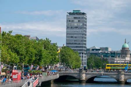 Dublin,Ireland - JULY 29, 2019: People Walking on Liffey river banks in Dublin city centerのeditorial素材