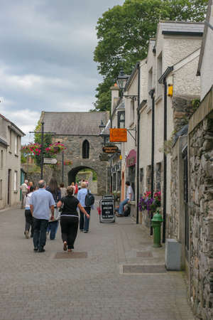 Dublin,Ireland - AUGUST 01, 2005: People Walking on the street Carlingford village centerのeditorial素材